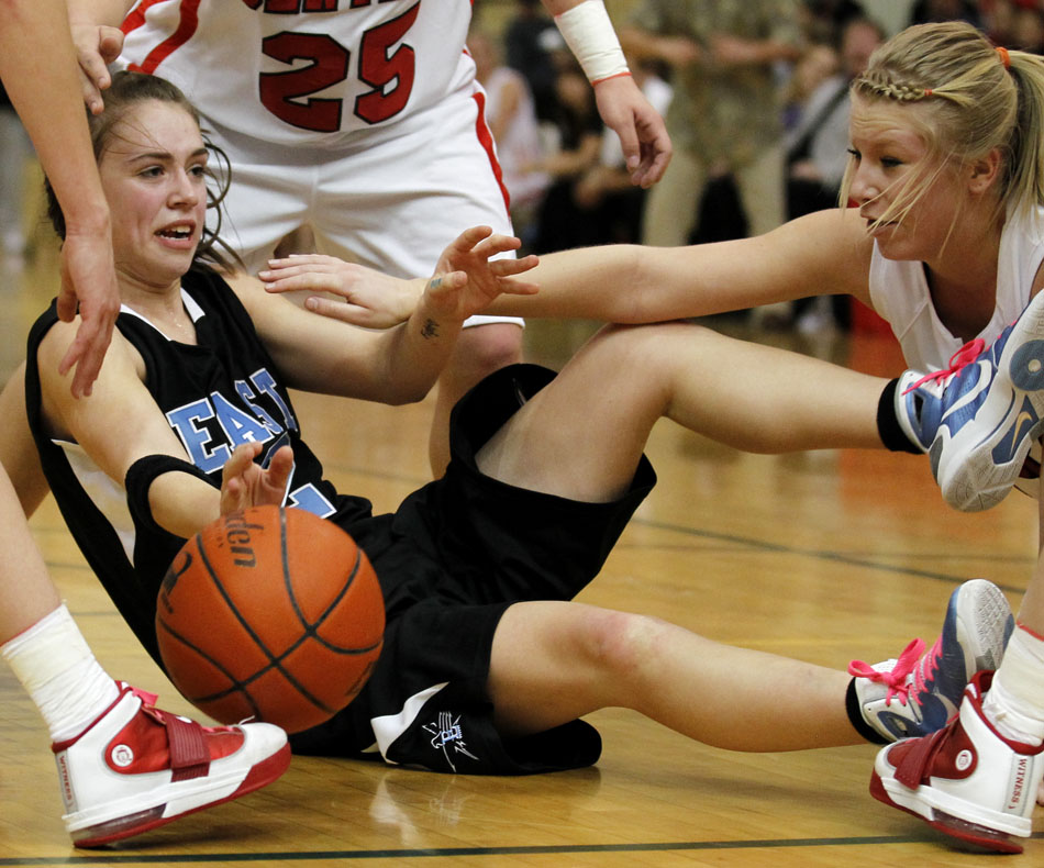 East's Savannah Minder looses the ball in a scramble on the floor during a game on Saturday, Feb. 12, 2011, at Storey Gym in Cheyenne. Central won 59-51.