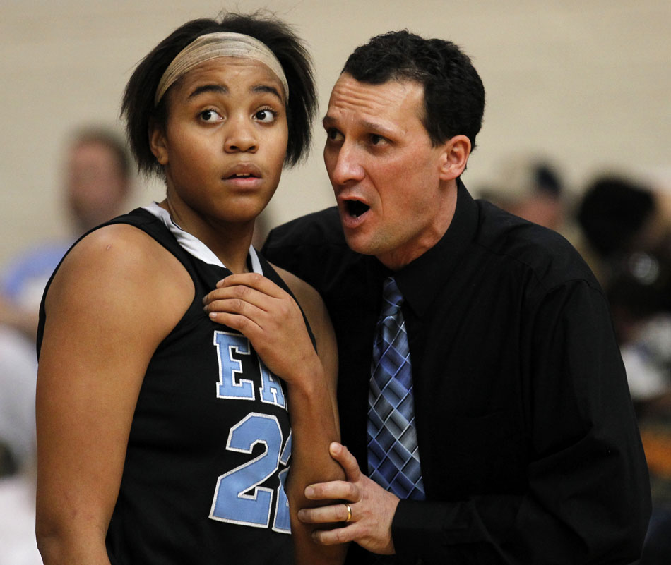 East coach Rusty Horsley, right, talks with Brittany Lawson after she fouled out late in a game against Central on Saturday, Feb. 12, 2011, at Storey Gym in Cheyenne. Central won 59-51.
