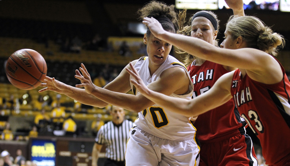 Wyoming guard Aubrey Vandiver (20) makes a no-look pass during a game against Utah on Wednesday, Feb. 16, 2011, in Laramie, Wyo.