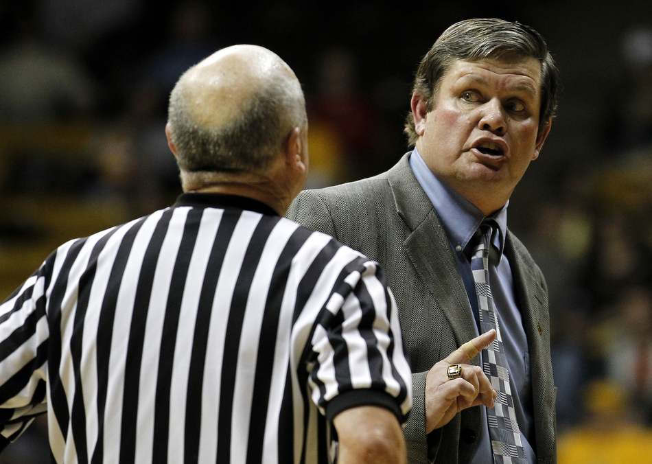 Wyoming coach Joe Legerski argues a call with an official during a game against Utah on Wednesday, Feb. 16,  2011, in Laramie, Wyo.