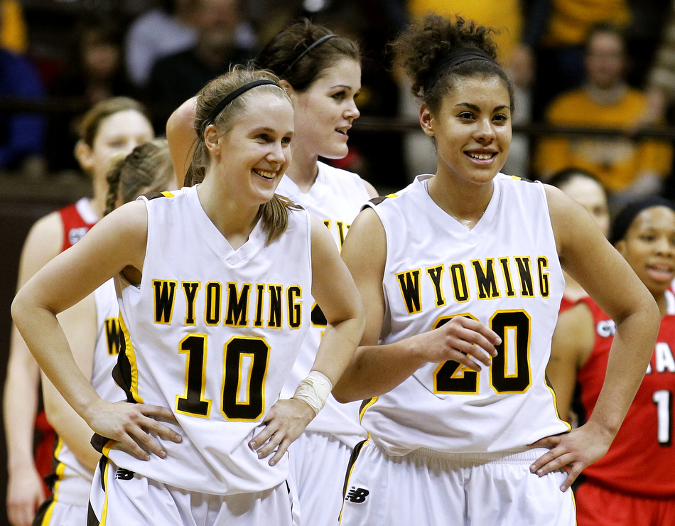 Wyoming guards Bec Campigli (10) and Aubrey Vandiver (20) react after Utah committed a foul sealing a 59-50 victory on Wednesday, Feb. 16, 2011, in Laramie, Wyo.