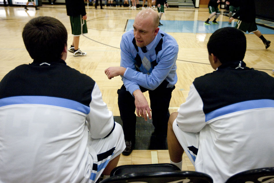 Cheyenne East coach Zane Jacobsen talks to his players before a game against Kelly Walsh on Thursday, Feb. 17, 2011, at East High School.
