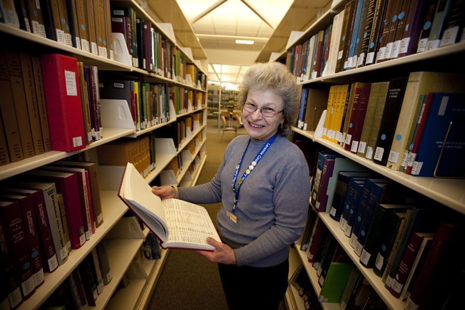 Lesley Vosler, a genealogist volunteer at the Laramie County Library, holds one of the library's hundreds of genealogy books on Friday, Feb. 18, 2011, in the genealogy room. Vosler has been volunteering at the library's genealogy room since 1997. "It's an addiction," she said of her work.