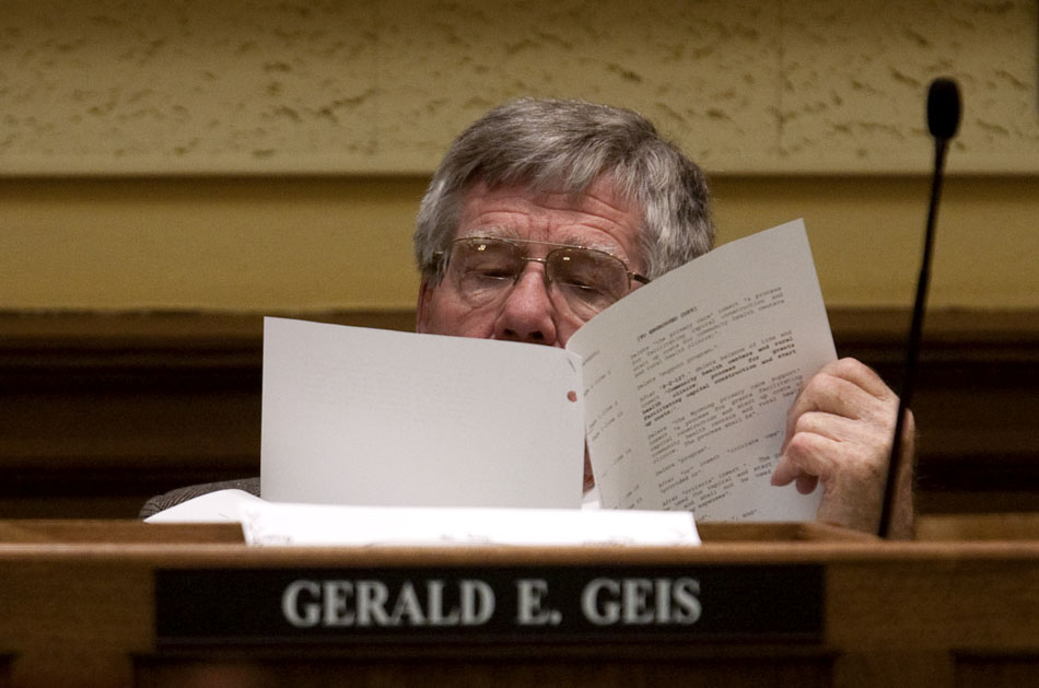 Sen. Gerald Geis, R-Worland, thumbs through the text of a proposed bill during a meeting of the Senate Committee of the Whole on Tuesday, Feb. 22, 2011, at the Wyoming State Capitol in Cheyenne.