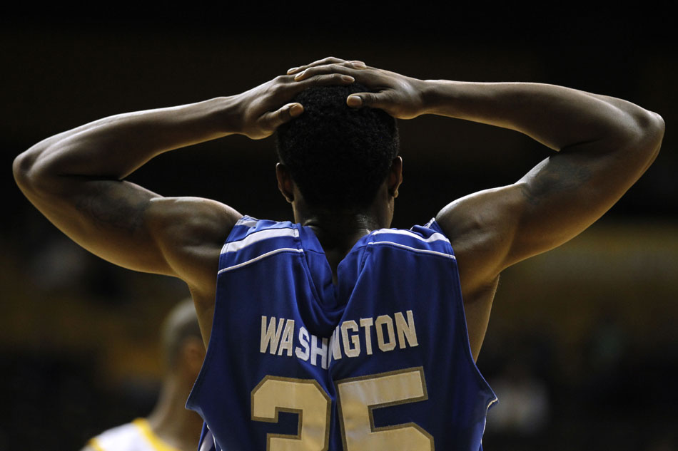 Air Force guard Evan Washington (35) puts his hands behind his head in frustration after his team committed a costly foul late in a loss to Wyoming during a NCAA men's basketball game on Wednesday, Feb. 23, 2011, in Laramie, Wyo.