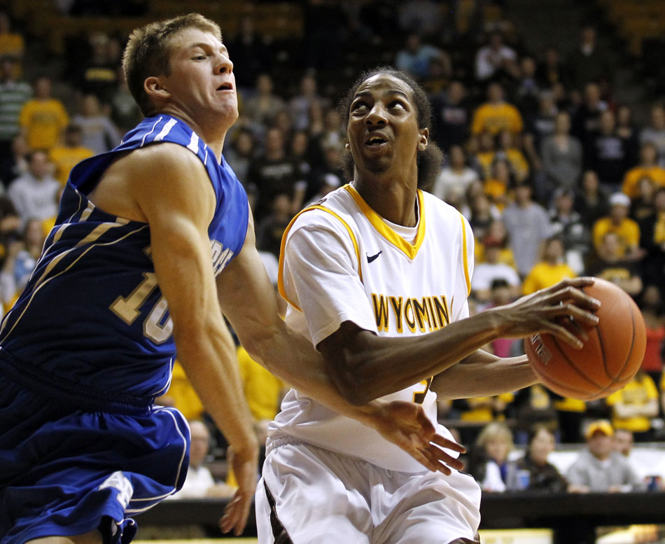 Wyoming guard Desmar Jackson (3) takes the ball to the hole off of a fast break as Air Force guard Todd Fletcher (10) defends during a NCAA men's basketball game on Wednesday, Feb. 23, 2011, in Laramie, Wyo.
