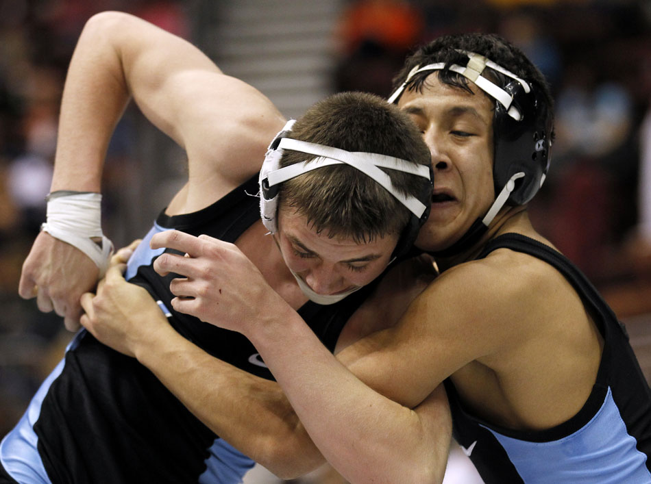 Cheyenne East's Blaze Cress, right, wrestles against teammate Luis Reyes in the Class 4A 119 pound semi-final on Friday, Feb. 25, 2011, in Casper, Wyo.