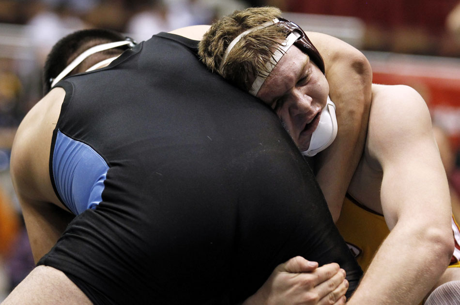 Star Valley's Dawson Loveland wrestles against Cheyenne East's Michael Galicia during a semi-final match in the 4A 215 pound weight class on Friday, Feb. 25, 2011, in Casper, Wyo. Loveland won the match.