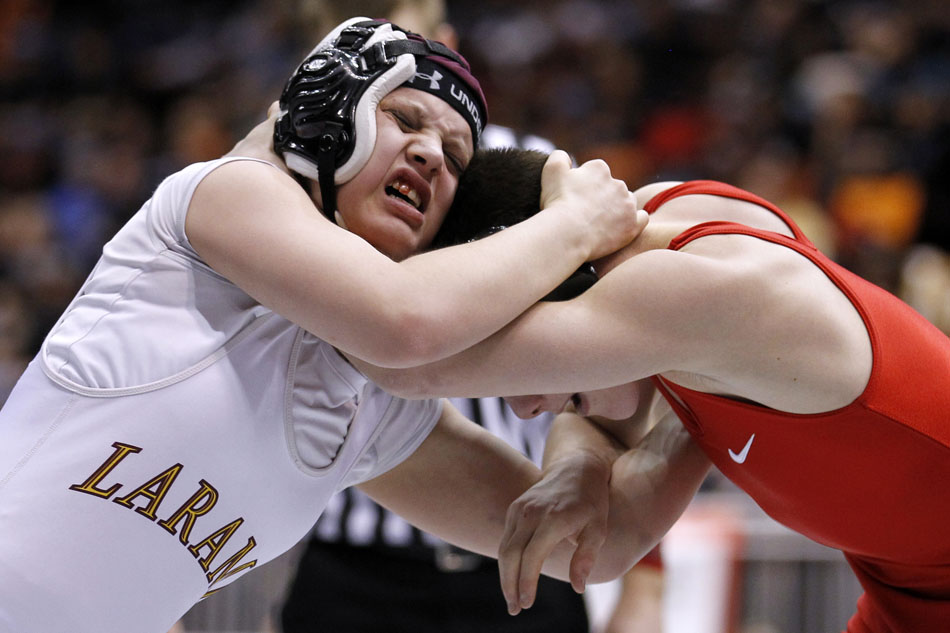 Laramie's Chantelle Lemus, left, wrestles with Cheyenne Central's Sammy Moody during a match in the Class 4A 103-pound weight class on Saturday, Feb. 26, 2011, in Casper, Wyo.