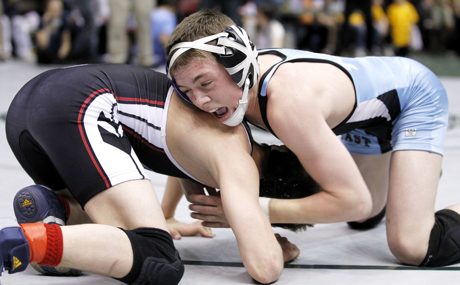 Cheyenne East's Brody Cress, right, wrestles Cheyenne Central's Sammy Moody during a wrestleback match in the Class 4A 103 pound bracket on Saturday, Feb. 26, 2011, in Casper, Wyo.