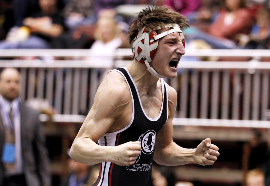 Cheyenne Central's Austin Vye celebrates after pinning Natrona County's Brandon Kussy in the Class 4A 112 pound third place match on Saturday, Feb. 26, 2011, in Casper, Wyo.