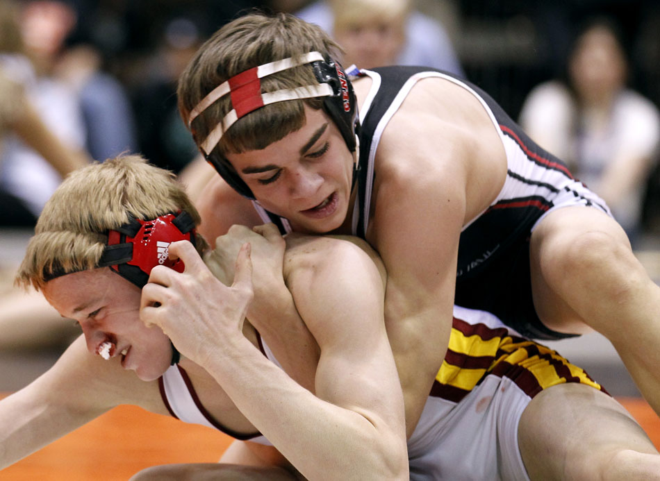 Cheyenne Central's Bryce Meredith wrestles against Star Valley's Mitch Heap during the 103 pound Class 4A championship match on Saturday, Feb. 26, 2011, in Casper, Wyo.