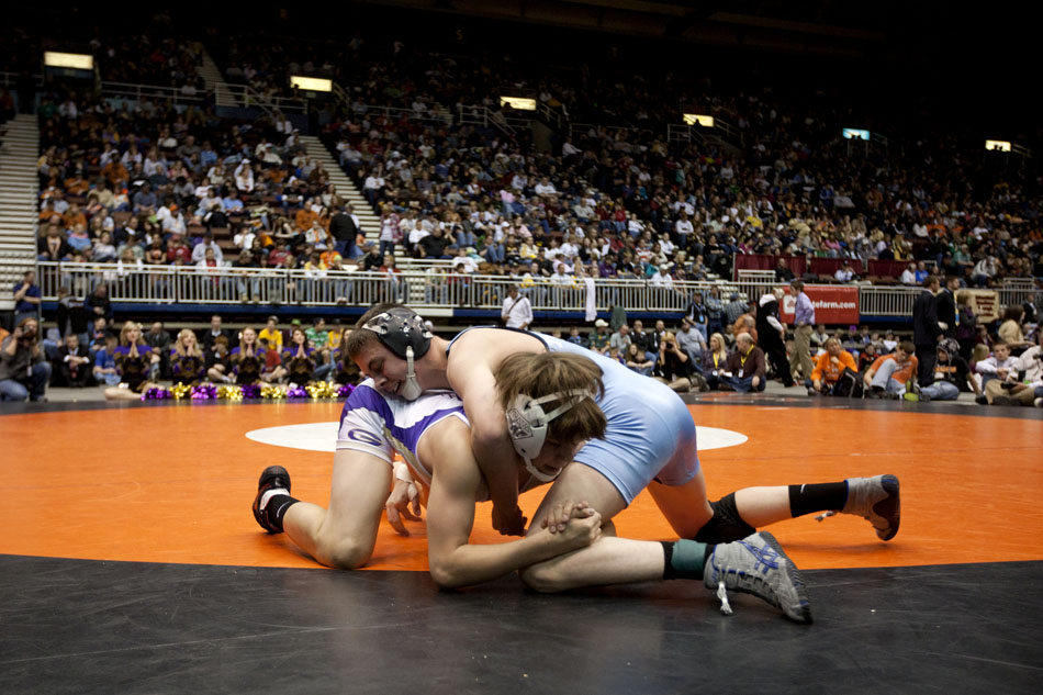 Cheyenne East's Blaze Cress, top, wrestles against Gillette's Lukas Poloncic during the Class 4A 119 pound final on Saturday, Feb. 26, 2011, in Casper, Wyo.