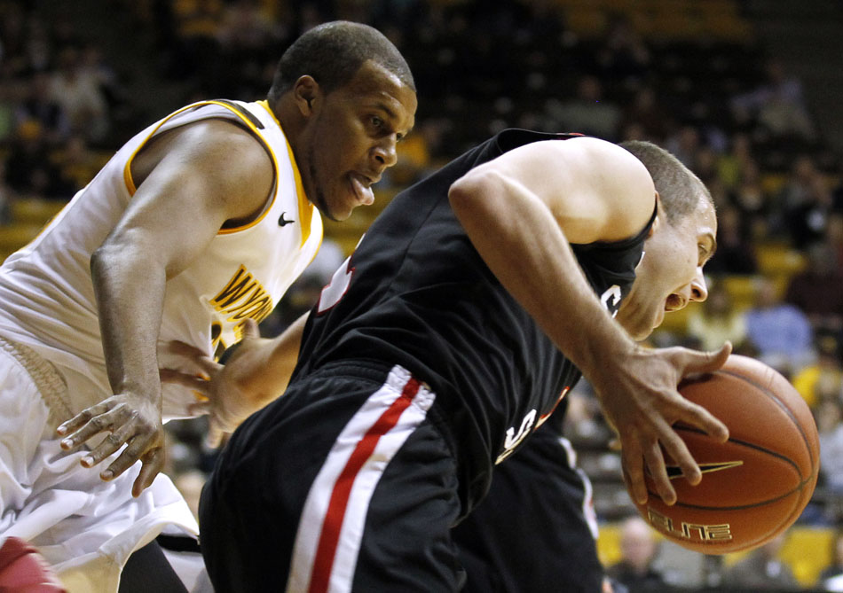Wyoming guard/forward Daylen Harrison, left, chases down San Diego State guard James Rahon (11) on defense during a NCAA men's basketball game on Tuesday, March 1, 2011, in Laramie, Wyo.