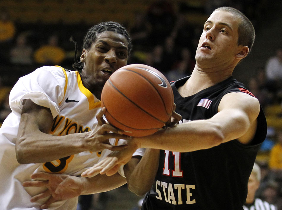 Wyoming guard Desmar Jackson (3) reacts as he commits a turnover after colliding with San Diego State guard James Rahon (11) during a NCAA men's basketball game on Tuesday, March 1, 2011, in Laramie, Wyo.