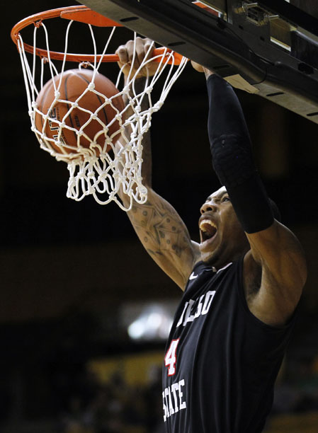 San Diego State forward Malcolm Thomas (4) reacts as he throws down a dunk during a NCAA men's basketball game against Wyoming on Tuesday, March 1, 2011, in Laramie, Wyo.