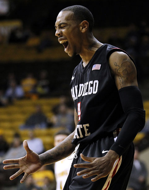 San Diego State forward Malcolm Thomas (4) reacts after he threw down a dunk during a NCAA men's basketball game against Wyoming on Tuesday, March 1, 2011, in Laramie, Wyo.
