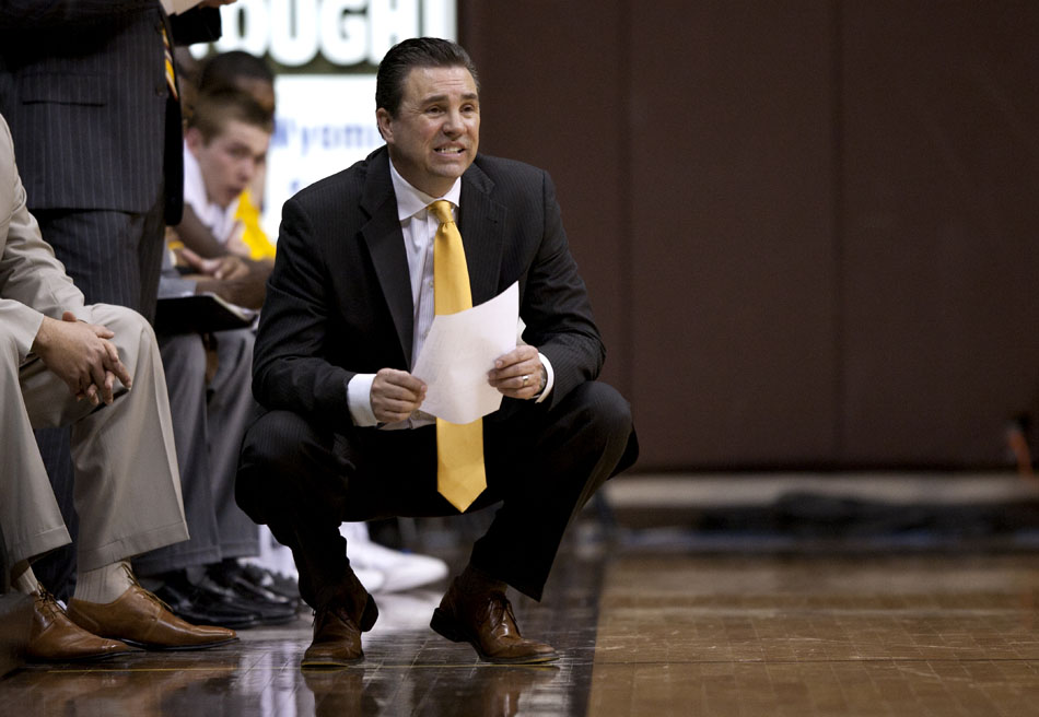 Wyoming interim coach Fred Langley reacts as he team got into a defensive set against San Diego State during a NCAA men's basketball game against Wyoming on Tuesday, March 1, 2011, in Laramie, Wyo.