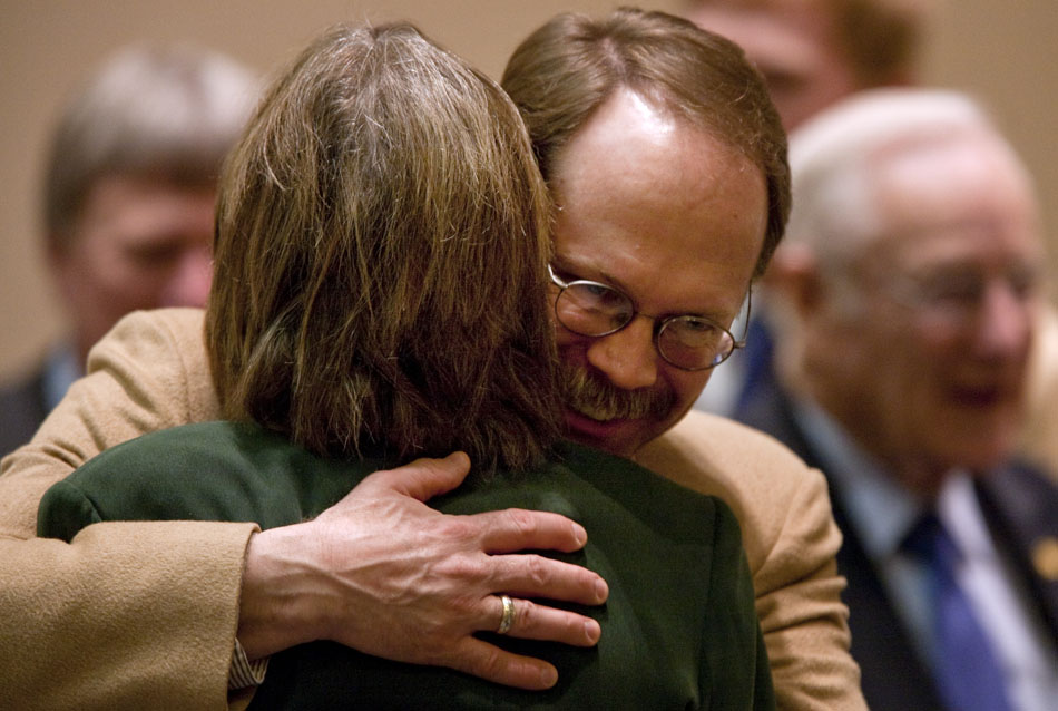 Rep. Jon Botten, R-Sheridan, hugs a fellow representative before the start of business in the chamber on Wednesday, March 2, 2011, at the Wyoming State Capitol in Cheyenne.