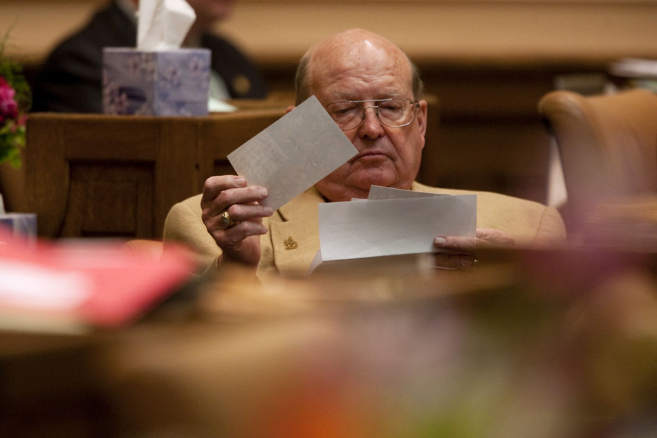 Rep. Del McOmie, R-Lander, looks through some paperwork on Wednesday, March 2, 2011, at the Wyoming State Capitol in Cheyenne.