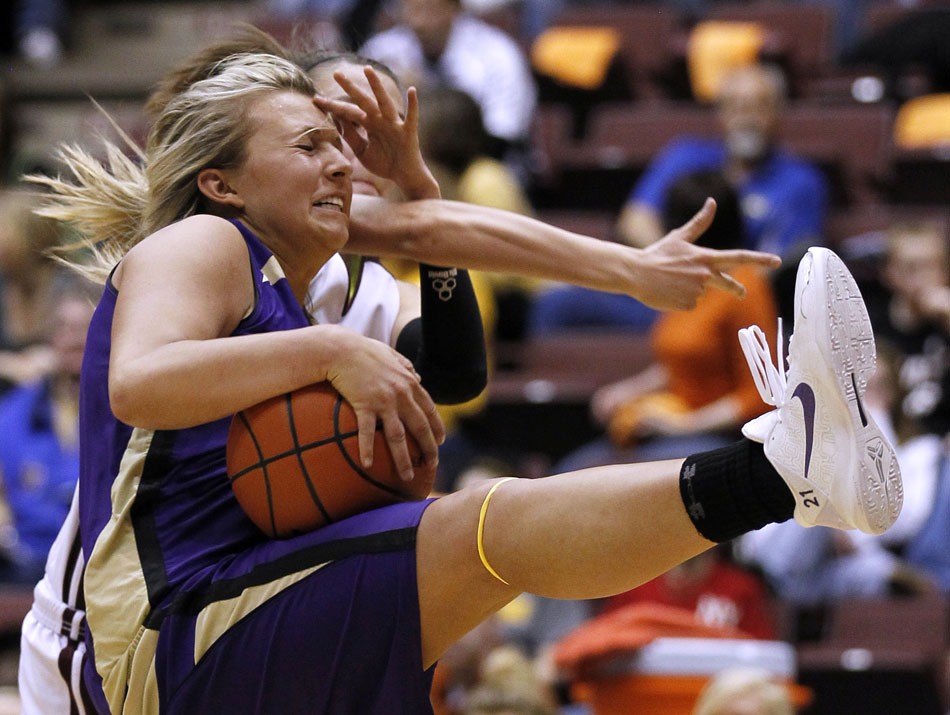 Gillette's Jordan Kelley reacts as she pulls down a rebound during a Class 4A girl's basketball semi-final on Friday, March 11, 2011, in Casper, Wyo.