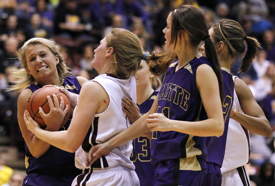 Gillette's Jordan Kelley, left, reacts as she fights for a rebound during a Class 4A girl's basketball semi-final on Friday, March 11, 2011, in Casper, Wyo.