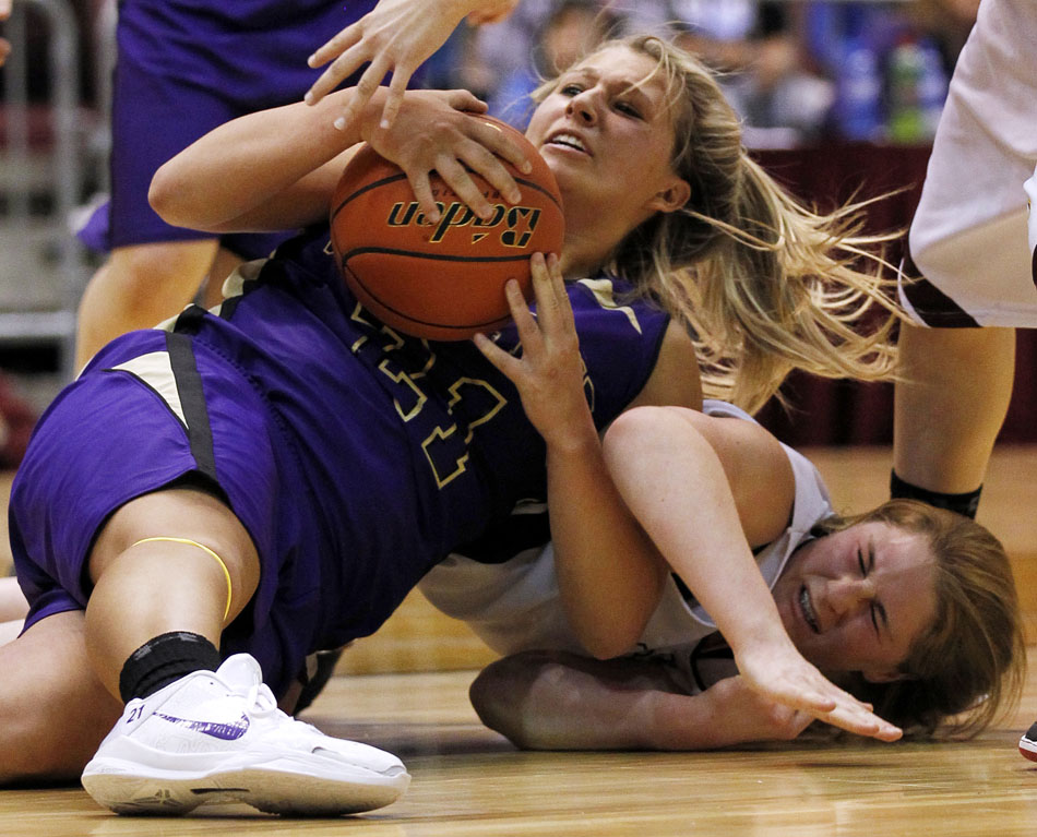 Gillette's Jordan Kelley, left, grabs the ball in a pileup with Laramie's Kensie Harris during a Class 4A girl's basketball semi-final on Friday, March 11, 2011, in Casper, Wyo.