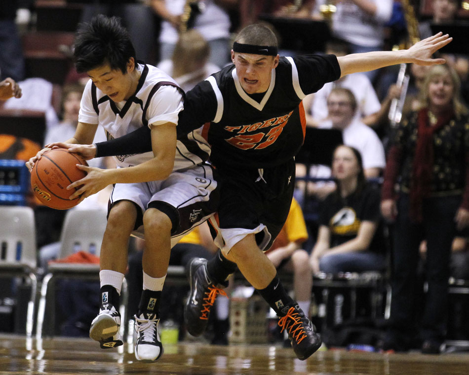 Rock Springs' Chase Riley (23) looks to strip the ball away from Laramie's Steven Rahel during a Class 4A boy's basketball semi-final on Friday, March 11, 2011, in Casper, Wyo.