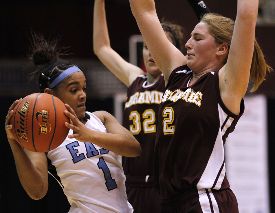 Cheyenne East's Lexi Hawkins (1) looks to pass in front of Laramie's Kensie Harris (2) during a Class 4A girl's basketball consolation final on Saturday, March 12, 2011, in Casper, Wyo.