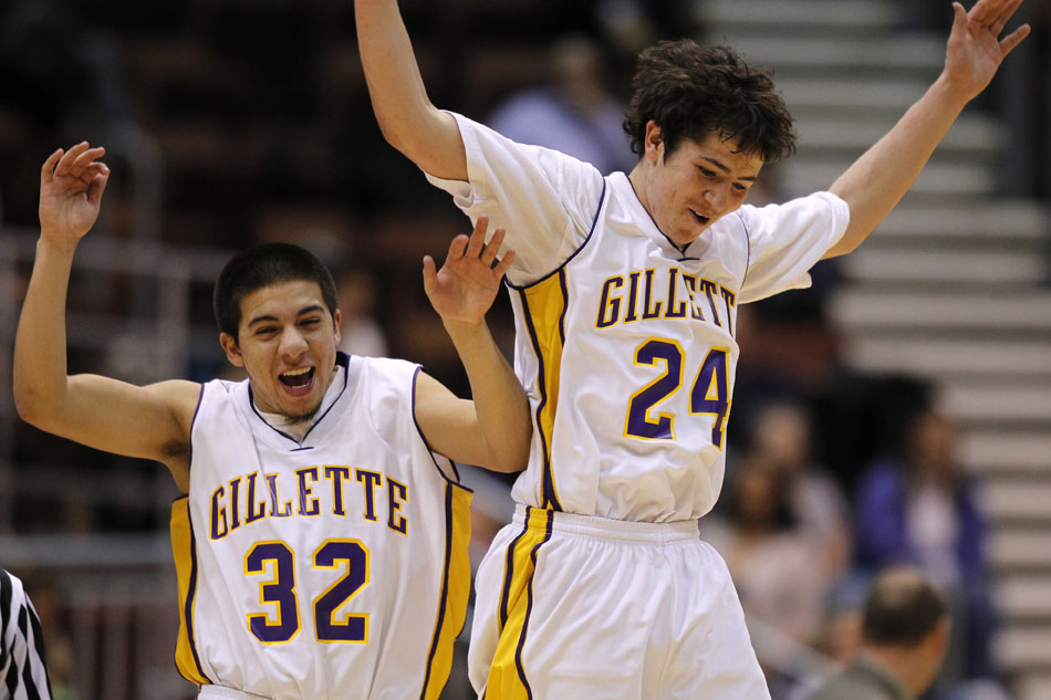 Gillette's Will Lopez (32) and Blaine Shaffer (24) celebrate after a buzzer-beater to end the third quarter during the Class 4A boy's basketball state championship game on Saturday, March 12, 2011, in Casper, Wyo.