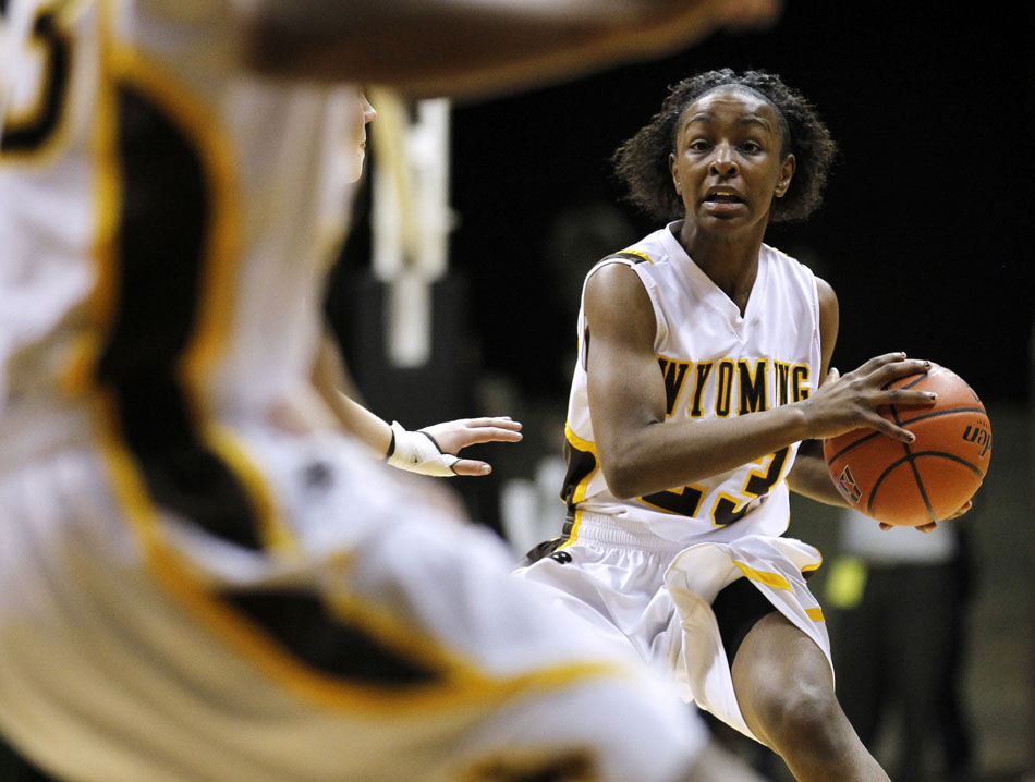 Wyoming guard Chelan Landry (23) looks to pass to a teammate late in a rout of Portland State in the first round of the WNIT game on Wednesday, March 16, 2011, in Laramie, Wyo.