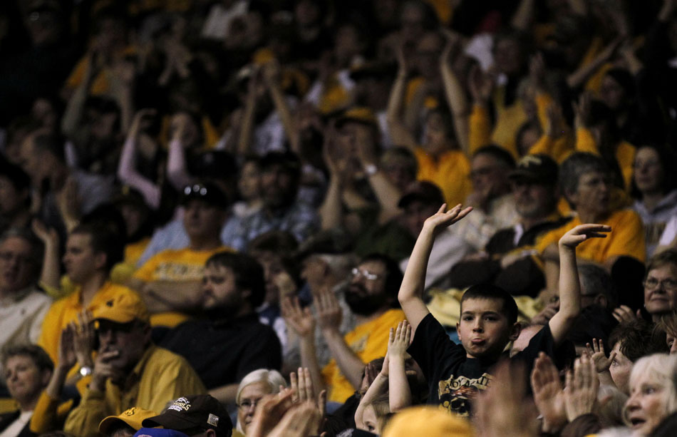 A youngster dances along with some music during a break in a first-round WNIT matchup between Wyoming and Portland State on Wednesday, March 16, 2011, in Laramie, Wyo.