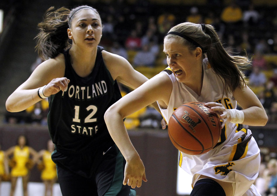 Wyoming guard Bec Campigli (10) drives to the basket during a WNIT game on Wednesday, March 16, 2011, in Laramie, Wyo.