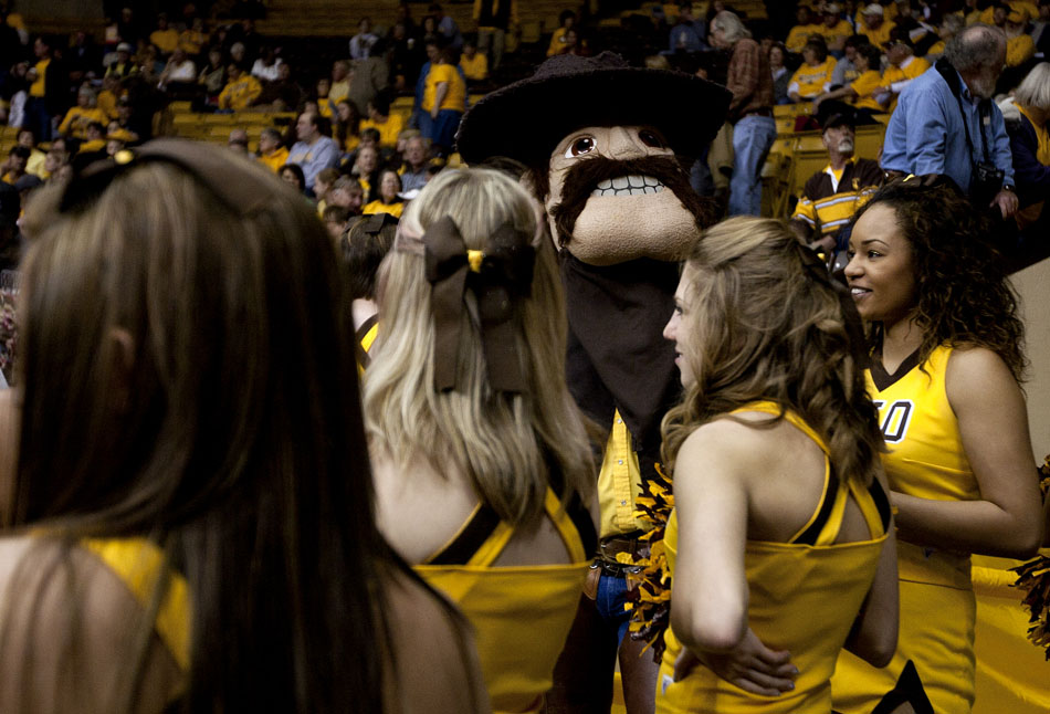 Pistol Pete stands with the Wyoming cheerleaders before a WNIT game against Portland State on Wednesday, March 16, 2011, in Laramie, Wyo.