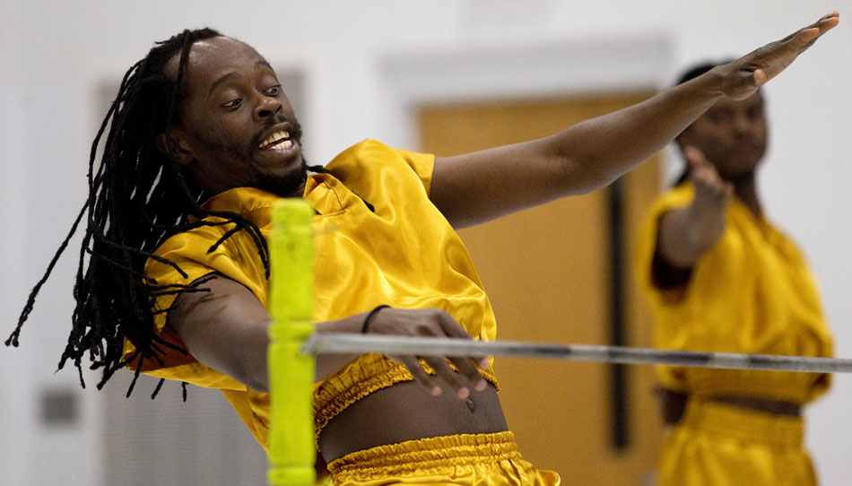 Zee Ali, a native of Kenya, reacts as he prepares to go under a limbo bar during a performance of African acrobatics on Friday, March 18, 2011, at Freedom Elementary in Cheyenne.