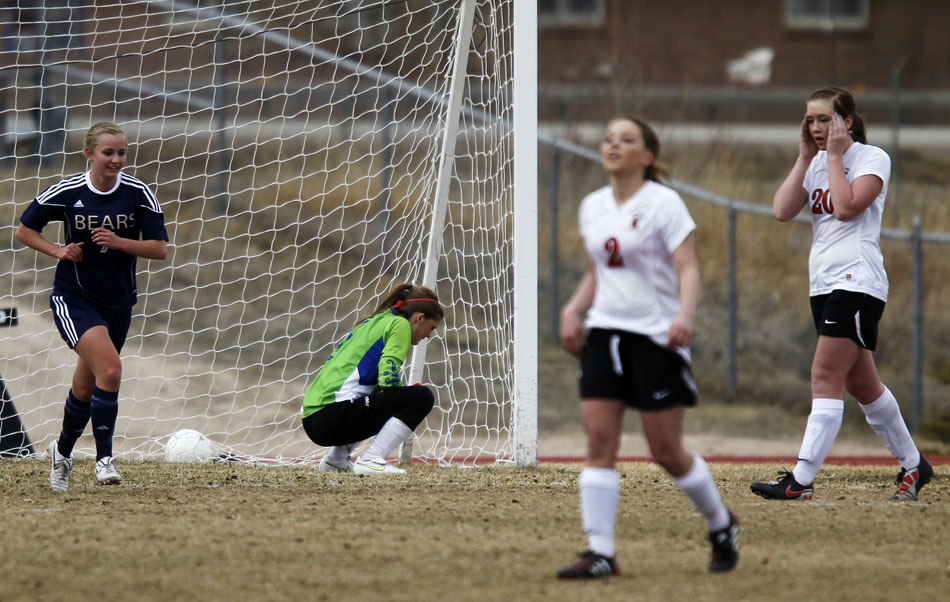 Cheyenne Central's Auri Fermelia (20) and keeper Kelly Fisher, in goal, react after Palmer Ridge scored a goal during a high school girl's soccer game on Saturday, March 19, 2011, at Cheyenne Central High School. Palmer Ridge won 3-2 in overtime.