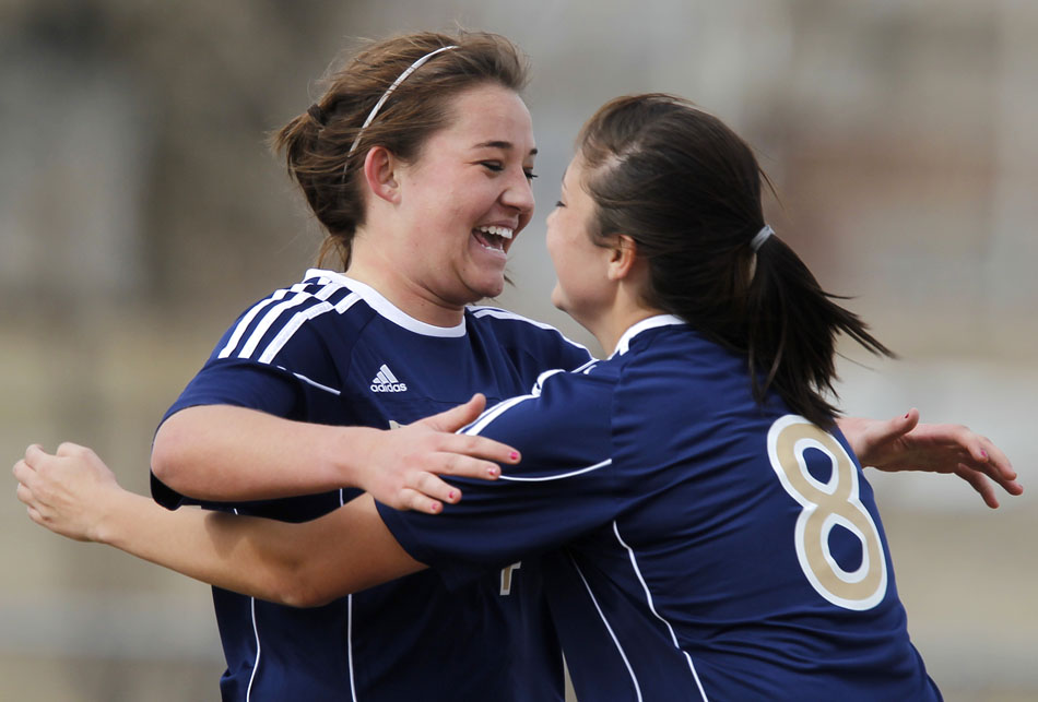 Palmer Ridge's Haley Olme, left, celebrates a goal with teammate Brooke Tominello (8) during a high school girl's soccer game on Saturday, March 19, 2011, at Cheyenne Central High School. Palmer Ridge won 3-2 in overtime.