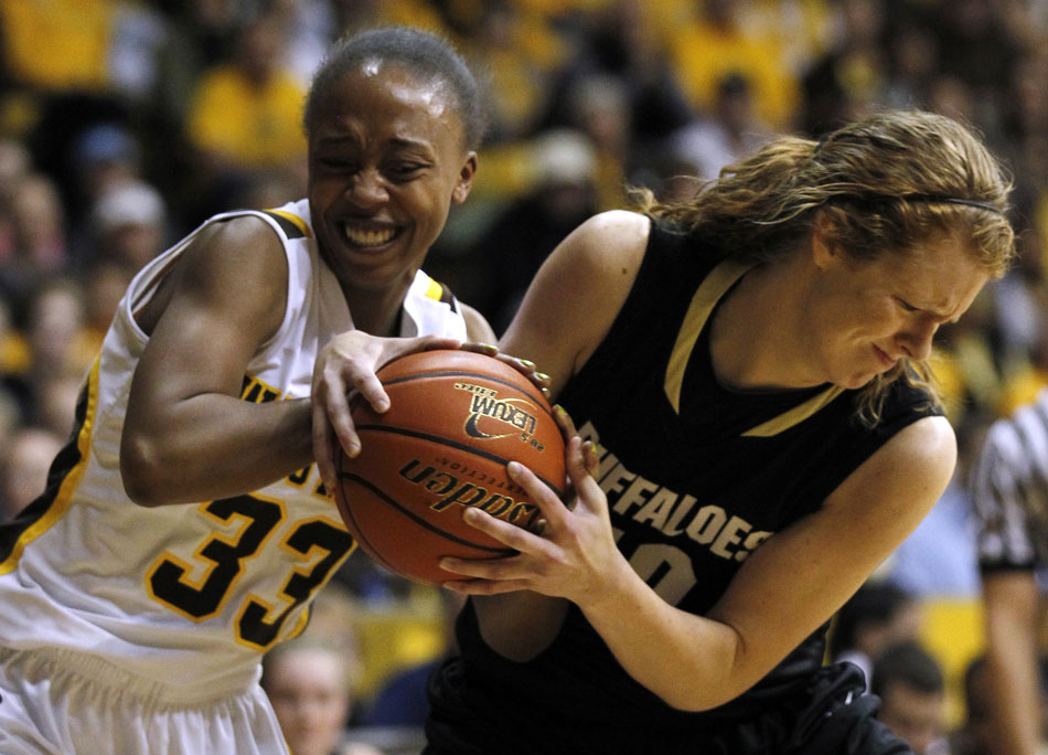 Wyoming's Chaundra Sewell (33) battles Colorado's Rachel Hargis (40) for the ball off of a rebound during a third round Women's NIT game on Thursday, March 24, 2011, in Laramie, Wyo.