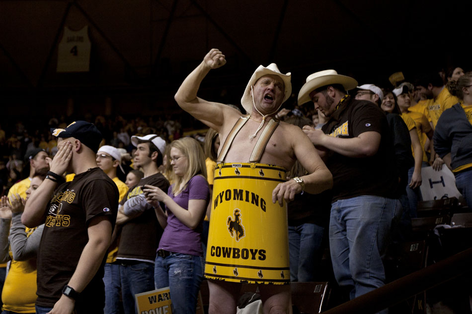A man dressed in a Wyoming bucket cheers on the team during a third round Women's NIT game on Thursday, March 24, 2011, in Laramie, Wyo.
