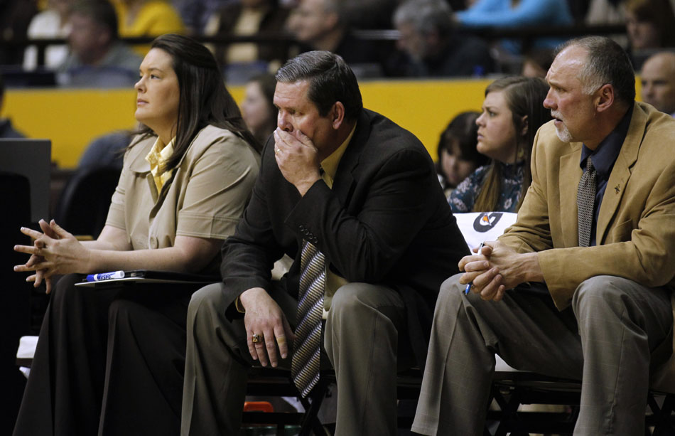 Wyoming coach Joe Legerski, center, watches the action late in a 70-58 loss to Colorado in the third round of the Women's NIT on Thursday, March 24, 2011, in Laramie, Wyo.