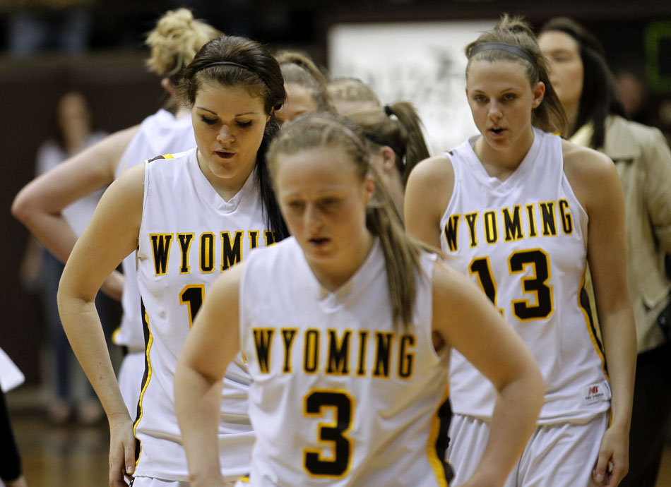 Wyoming's Jade Kennedy (14), left, Randi Richardson (3) and Ashley Sickles (13) make their way off the court after a 70-58 loss to Colorado in the third round of the Women's NIT on Thursday, March 24, 2011, in Laramie, Wyo.