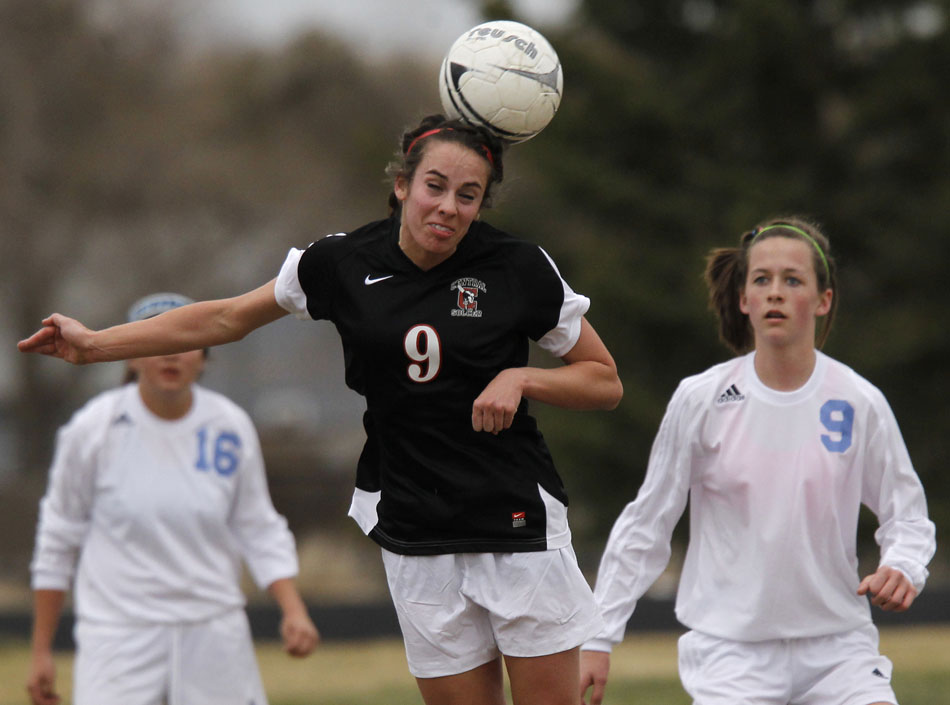 Cheyenne Central's Makena Cameron (9) heads the ball during a high school girl's soccer game on Friday, March 25, 2011, at Cheyenne East High School.