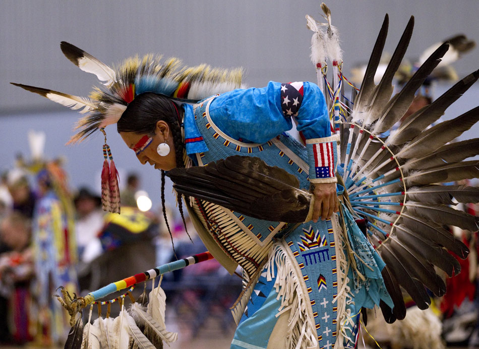 A dancer performs in a men's traditional dance demonstration during a powwow held by the Southeast Wyoming Inter-Tribal Powwow Association (SEWIPA) on Saturday, March 26, 2011, at Laramie County Community College in Cheyenne.