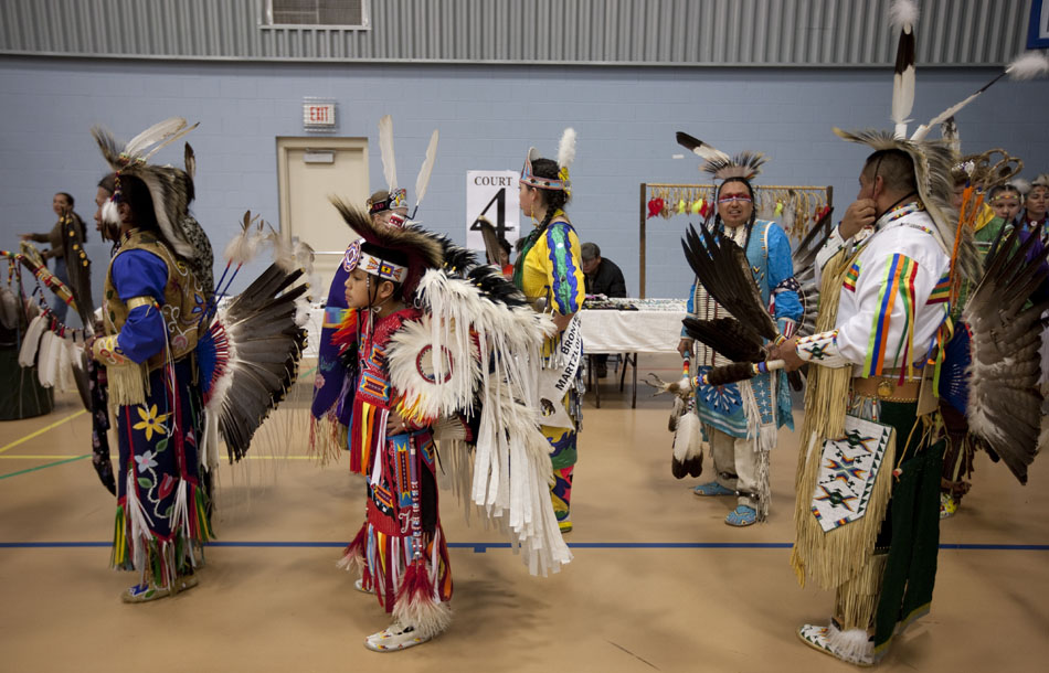 Performers  wait in line for the start of an inter-tribal dance during a traditional powwow held by the Southeast Wyoming Inter-Tribal Powwow Association (SEWIPA) on Saturday, March 26, 2011, at Laramie County Community College in Cheyenne.
