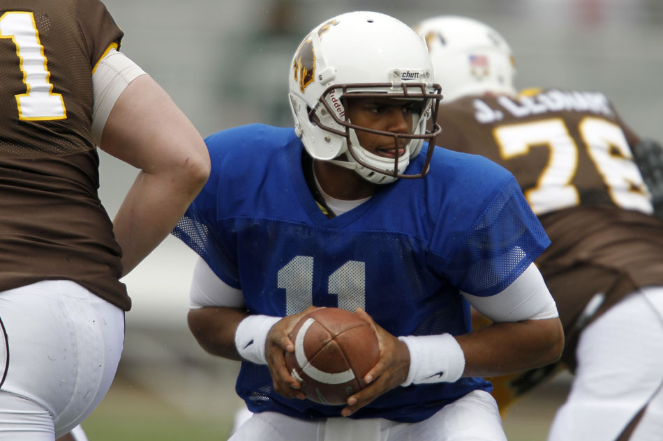Wyoming quarterback Emory Miller Jr. (11) prepares to hand off during Wyoming's Brown and Gold spring football game on Saturday, April 9, 2011, in Laramie, Wyo. Gold won 14-13.