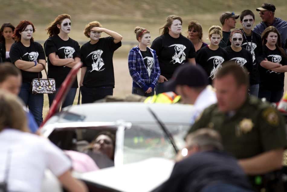 Students watch as first responders work the scene of a two-car drunken driving accident demonstration on Tuesday, April 12, 2011, at Cheyenne East High School. The students were pulled out of class every 15 minutes on Tuesday between 8 a.m. and 1 p.m. to signify that one student dies every 15 minutes in alcohol-related accidents.
