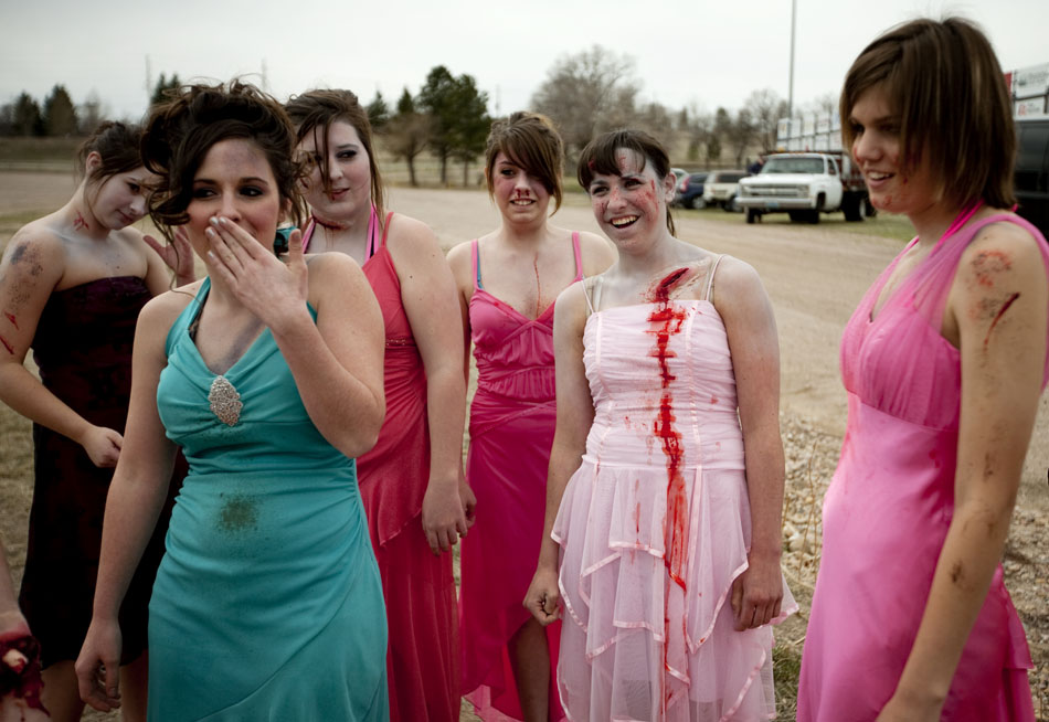 Cheyenne East students share a laugh before climbing into wrecked vehicles to portray victims at the scene of a bad accident for a drunken driving crash demonstration on Tuesday, April 12, 2011, at Okie Blanchard Stadium. The demonstration coincides with East's prom this Saturday.