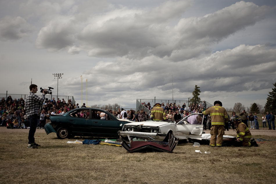 Firefighters work the scene of a drunk crash demonstration on Tuesday, April 12, 2011, at Okie Blanchard Stadium. The demonstration coincides with East's prom this Saturday.
