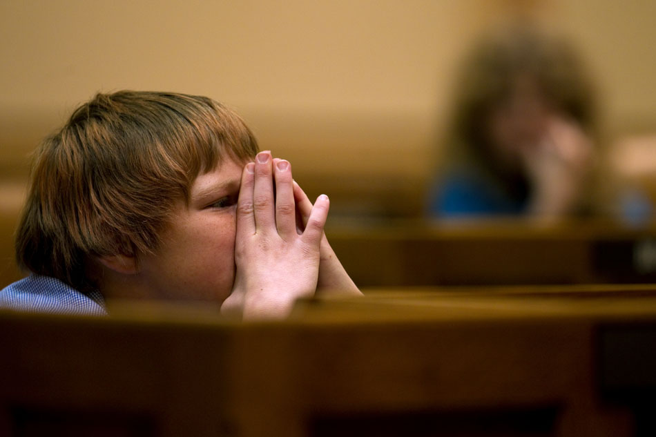Jayson Tretter, a fifth grader at Arp Elementary, listens to debate on a mock bill that would establish a dress code for teachers on Tuesday, April 26, 2011, on the floor of the House chambers in the Wyoming State Capitol.