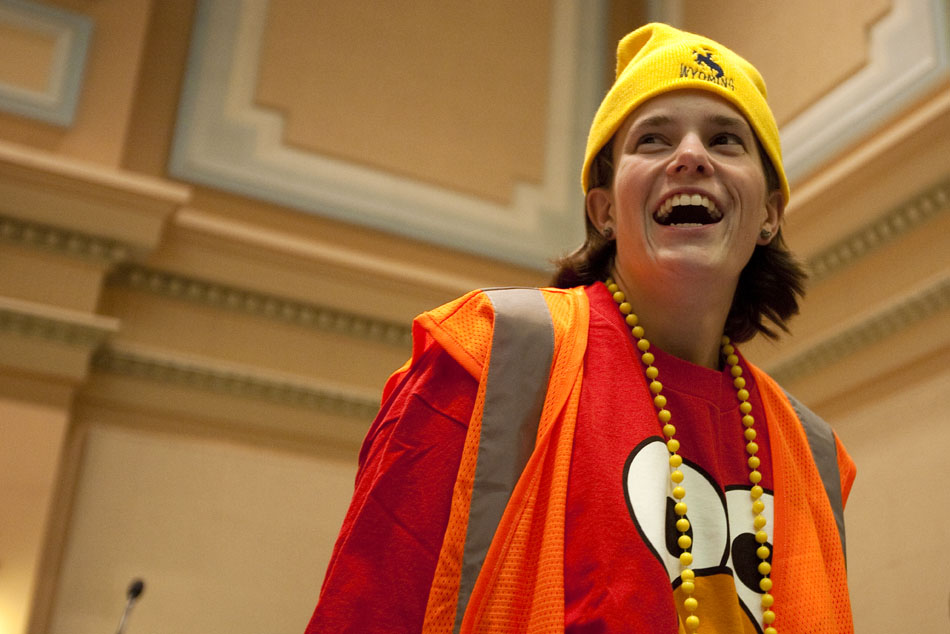 Katie Mugg, a tutor at Arp Elementary, laughs as fifth graders from the school debate a mock bill that would require teachers to dress outrageously on Tuesday, April 26, 2011, on the floor of the House chambers in the Wyoming State Capitol.